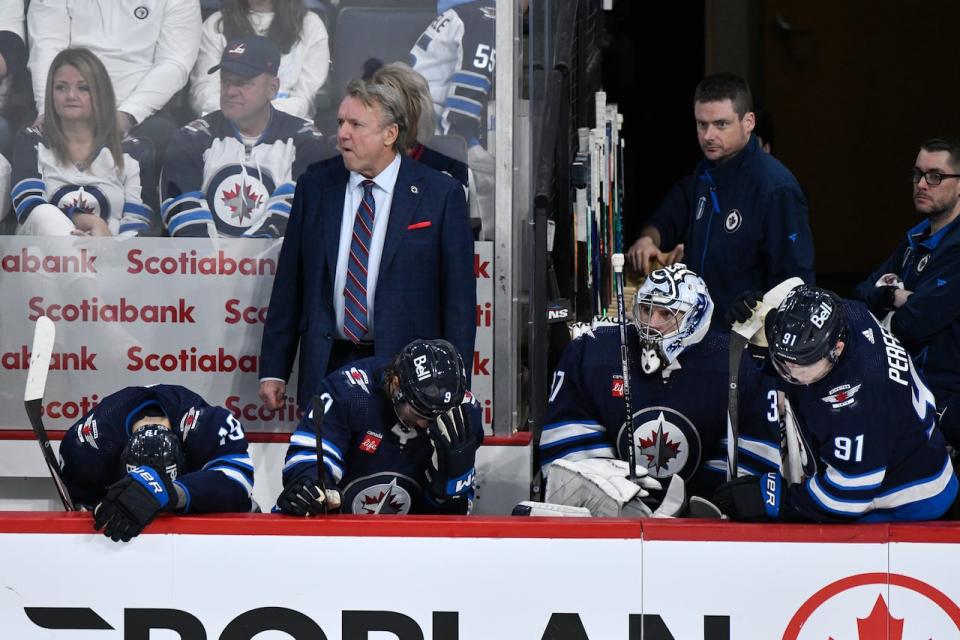 Winnipeg Jets' head coach Rick Bowness and players watch the end of Game 5 of their NHL hockey Stanley Cup first-round playoff series against the Colorado Avalanche in Winnipeg, Tuesday April 30, 2024. THE CANADIAN PRESS/Fred Greenslade