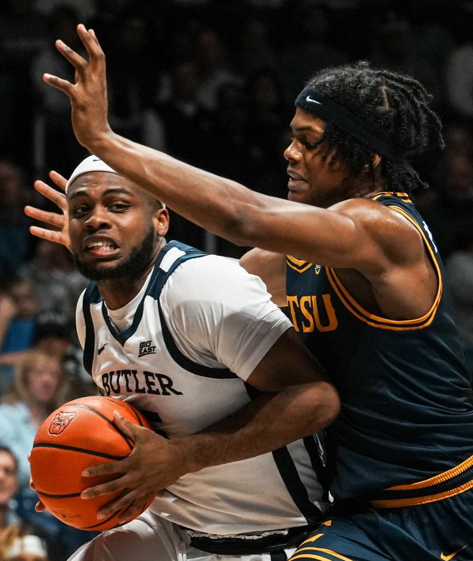 Butler Bulldogs guard Posh Alexander (5) drives to the basket under pressure from East Tennessee State Buccaneers guard Quimari Peterson (1) during the game between Butler Bulldogs and East Tennessee State Buccaneers Monday, Nov. 13, 2023, at Hinkle Fieldhouse in Indianapolis. Bulldogs beat Buccaneers 81-47.