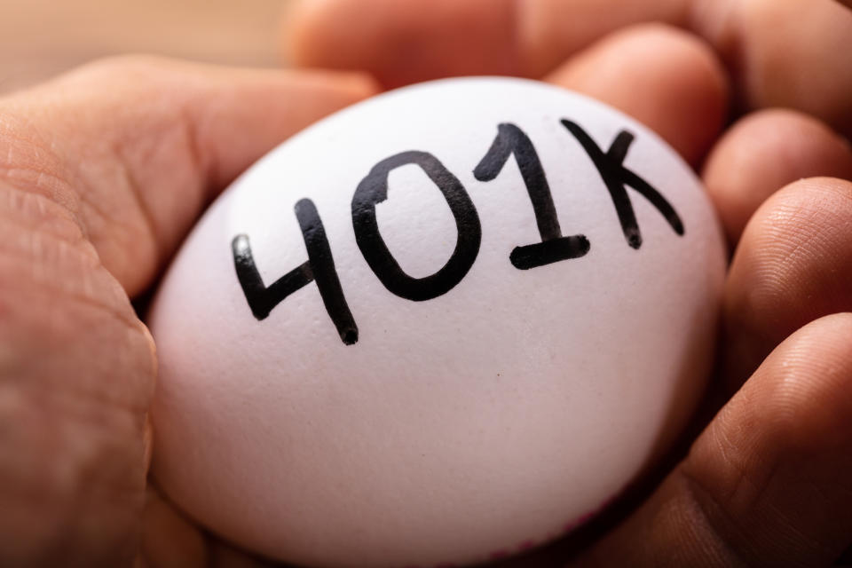 A hand is holding an egg, on which is printed "401k."