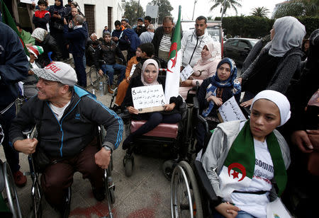 People with special needs, accompanied by their families, take part in a protest demanding immediate political change and improvement of their living conditions in Algiers, Algeria March 14, 2019. REUTERS/Ramzi Boudina