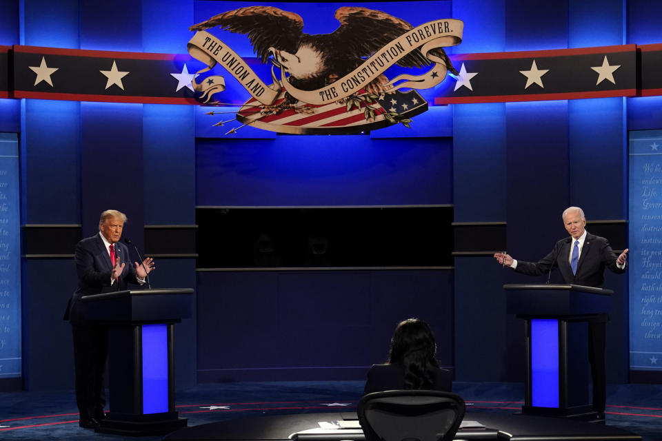 FILE - President Donald Trump and Democratic presidential candidate former Vice President Joe Biden participate in the final presidential debate at Belmont University, Oct. 22, 2020, in Nashville, Tenn. (AP Photo/Patrick Semansky)