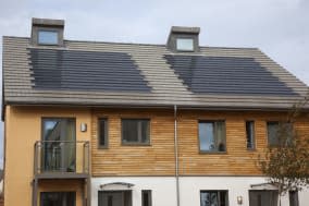 England, West Sussex, Chichester, Graylingwell Park, Modern housing with solar panels blended seamlessly in to roof tiles....