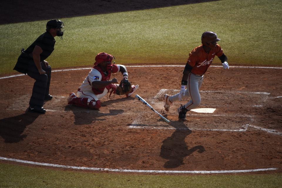 Texas Longhorns outfielder Porter Brown (4) makes a hit against the Louisiana Ragin Cajuns during the first round in the NCAA baseball College Station Regional May 31, 2024, at Olsen Field in College Station.