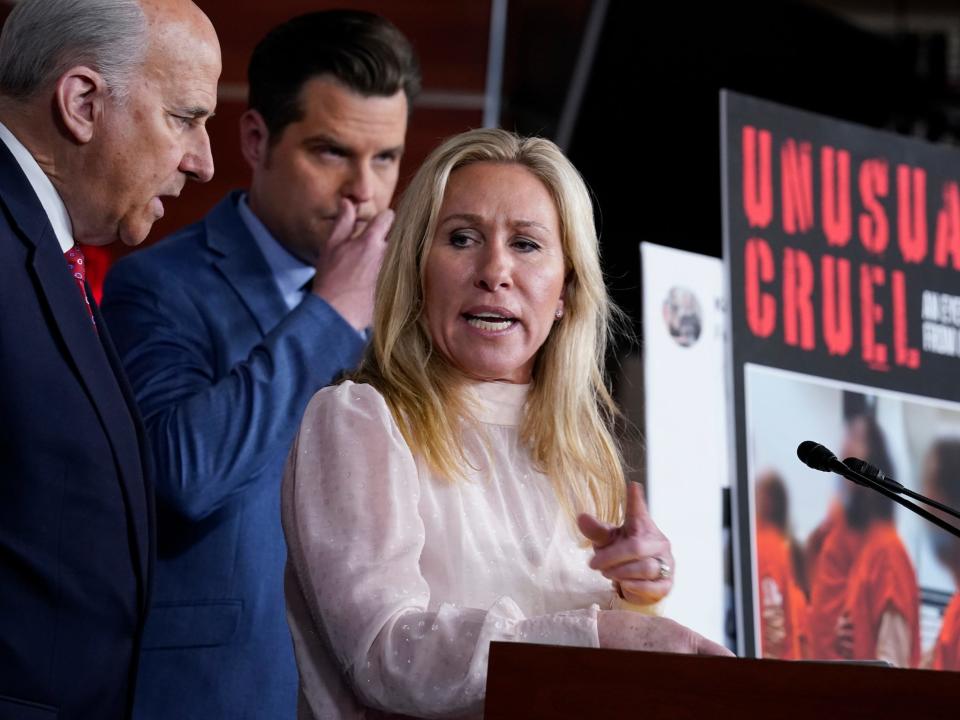 Rep. Marjorie Taylor Greene, R-Ga., joined from left by Rep. Louie Gohmert, R-Texas, and Rep. Matt Gaetz, R-Fla., speaks at a news conference about the treatment of people being held in the District of Columbia jail who are charged with crimes in the Jan. 6 insurrection, at the Capitol in Washington, Tuesday, Dec. 7, 2021.