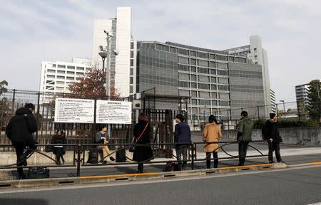 Journalists stand in front of Tokyo Detention Center, where Nissan Chairman Carlos Ghosn is believed to be held, in Tokyo, Japan November 21, 2018. REUTERS/Toru Hanai