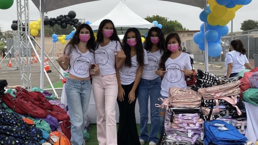 Layla and Delara Tehranchi alongside volunteers with Coco's Angels at a back to school event in September 2023. (Layla Tehranchi/Spotlight Public Relations)