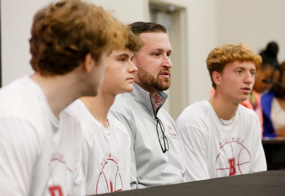 Brookwood High Head Coach Joe Childers answers questions with his players during basketball media day for Tuscaloosa City and County Schools Thursday, Oct. 28, 2021, at Shelton State's Fredd Campus. [Staff Photo/Gary Cosby Jr.]