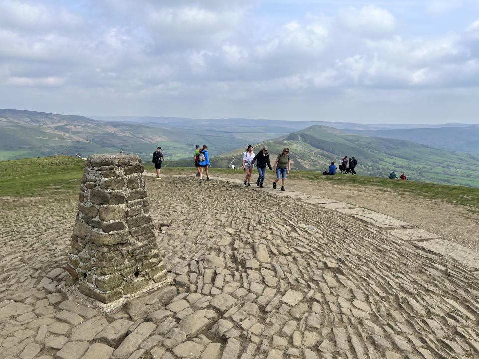 Hikers reach the top of Mam Tor, a 517 meters high (1,696 feet) hill in England’s Peak District National Park on May 8, 2024. (Steve Wartenberg via AP)