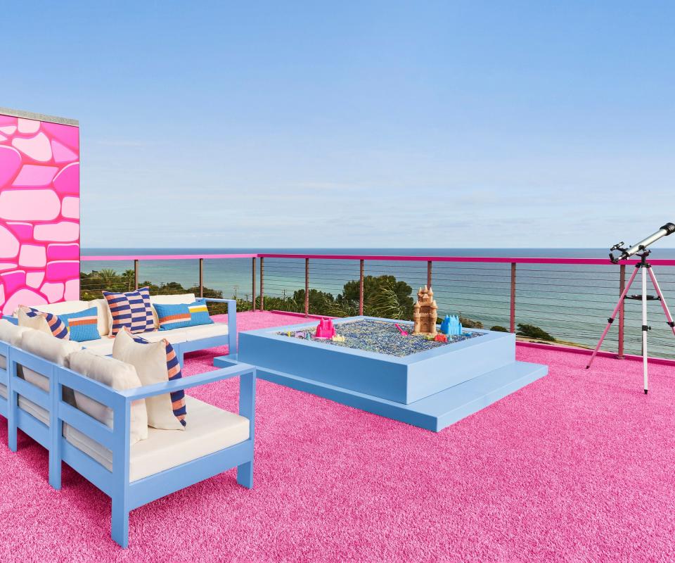 Pink floor, blue fireplace and sofas