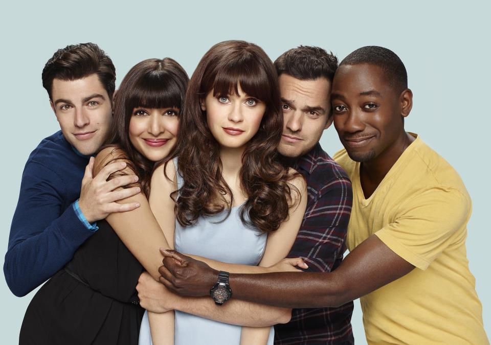 The cast of "New Girl" holding each other