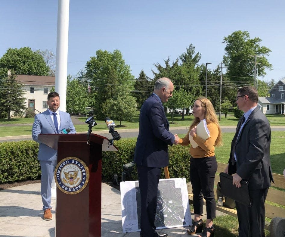 Sen. Bob Casey meets with Jodi Cutaiar of West Rockhill at the Perkasie Regional Authority while Nicholas Fretz (left), authority manager, and Robert Boos, executive director of the Pennsylvania Infrastructure Investment Authority (PennVest) watches.