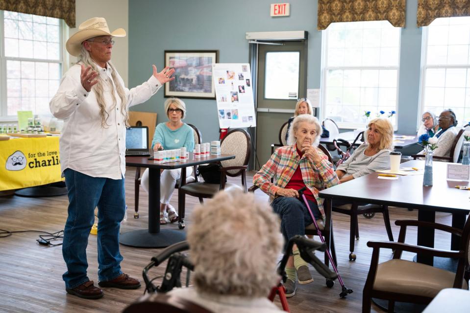 Tucker Jasso, 60, founder of For the Love of Charlie, talks with seniors about her cannabis company, at Baldwin House Senior Living in Hazel Park on Wednesday, Aug. 9, 2023.