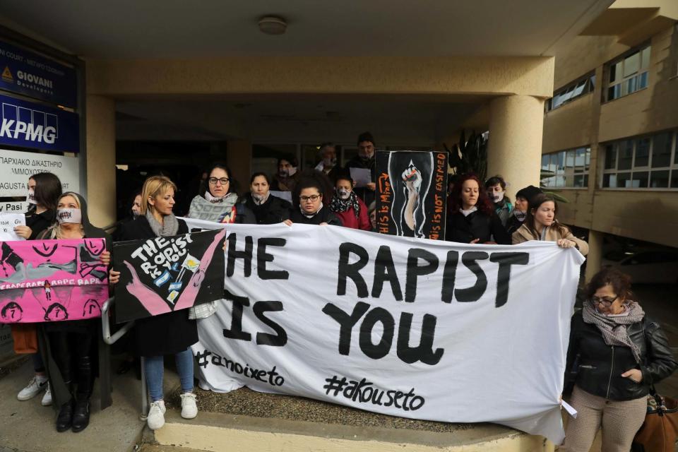 Activists outside court after a British woman was found guilty of faking a gang rape claim (REUTERS)