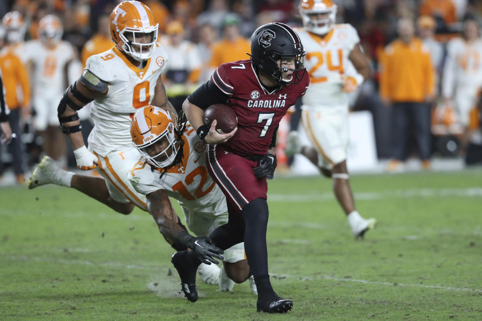 South Carolina quarterback Spencer Rattler (7) is tackled by Tennessee defensive back Tamarion McDonald (12) during the second half of an NCAA college football game Saturday, Nov. 19, 2022, in Columbia, S.C. (AP Photo/Artie Walker Jr.)