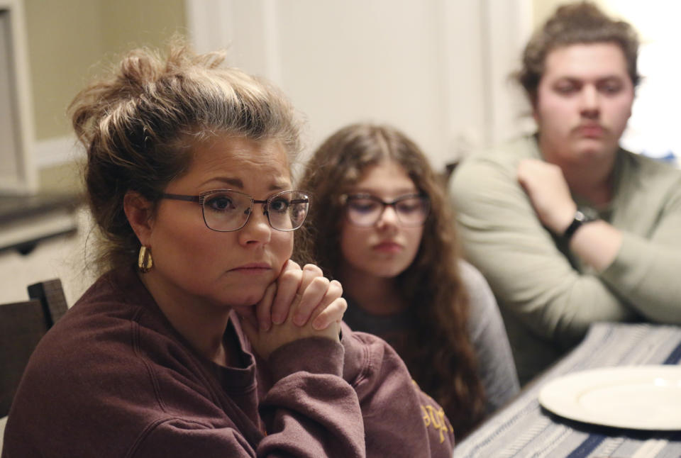 From left, Gina Brooks; her daughter Jocelyn, 13; and her son Jacob, 18, discuss their faith, values and political views, in Bluefield, W.Va., on Monday, Jan. 25, 2021. Brooks, who leads the children's ministry at Father's House International Church, condemned the violence at the U.S. Capitol on Jan. 6 but supports her pastor's right to attend the "Save America" rally that day in Washington. (AP Photo/Jessie Wardarski)