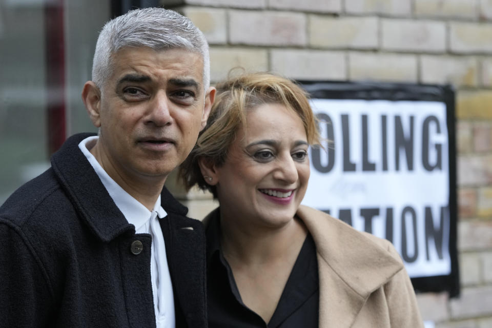 London Mayoral Labour Party candidate Sadiq Khan and his wife Saadiya Ahmed pose for the media as they arrive to vote in London, Thursday, May 2, 2024. Khan, is seeking re-election, and standing against 12 other candidates for the post of Mayor of London. There are other Mayoral elections in English cities and as well as local council elections. (AP Photo/Kin Cheung)