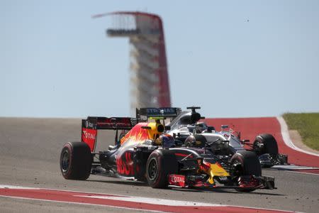 Formula One F1 - U.S. Grand Prix - Circuit of the Americas, Austin, Texas, U.S., 21/10/16. Red Bull's Max Verstappen of the Netherlands (L) and Mercedes' Lewis Hamilton of Britain participate in the second practice session. REUTERS/Adrees Latif