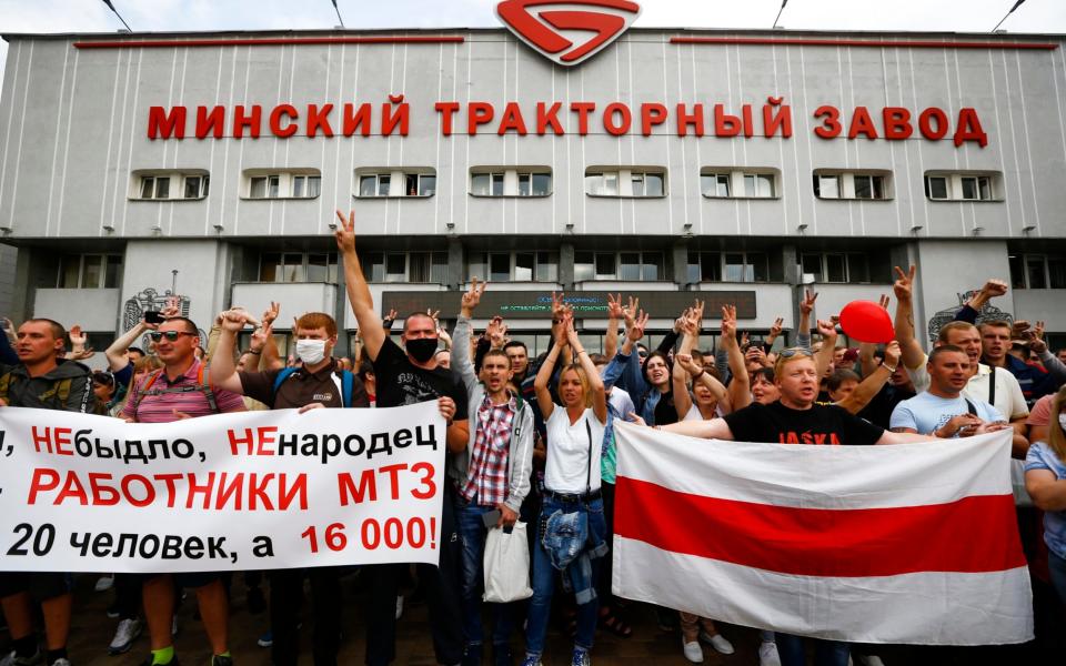 Workers of the Minsk Tractor Works protested outside the iconic plant in a major blow for Mr Lukashenko - Sergei Grits/AP