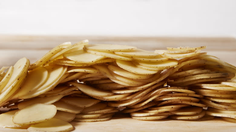 Thinly sliced potatoes in pile