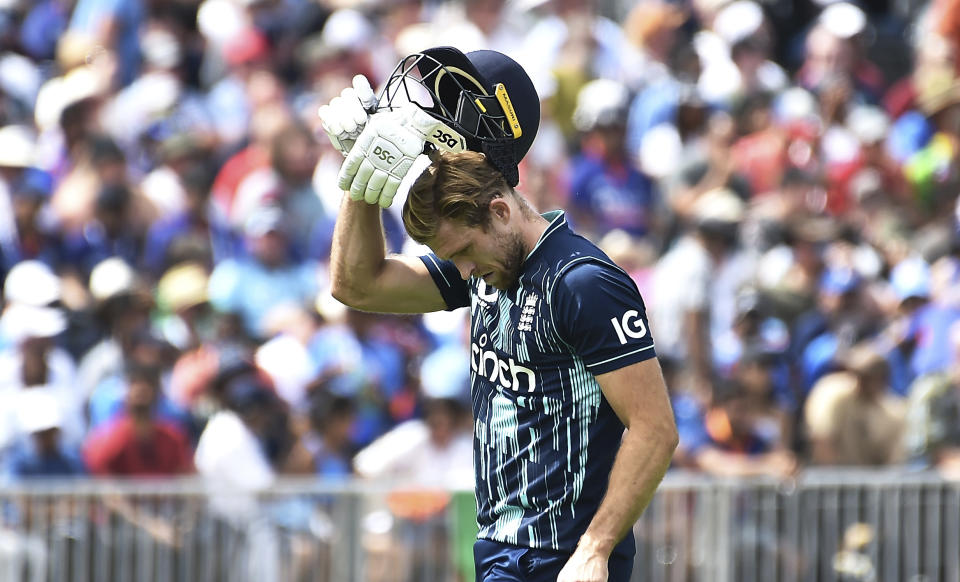 England's David Willey, returns to the pavilion after being dismissed by India's Yuzvendra Chahal during the third one day international cricket match between England and India at Emirates Old Trafford cricket ground in Manchester, England, Sunday, July 17, 2022. (AP Photo/Rui Vieira)