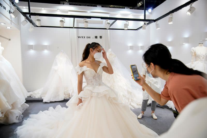 The Wider Image: Coronavirus dampens celebrations in China's wedding gown city