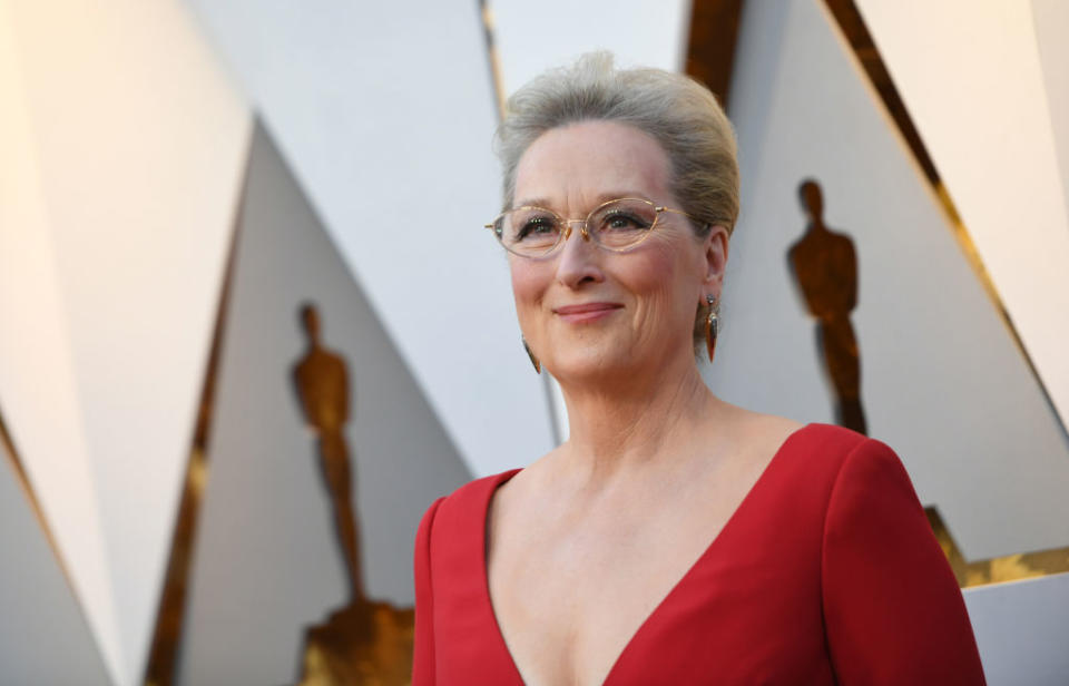 <p>Meryl Streep wears chic glasses with her Dior red gown at the 2018 Oscars red carpet. (Photo: Getty Images) </p>