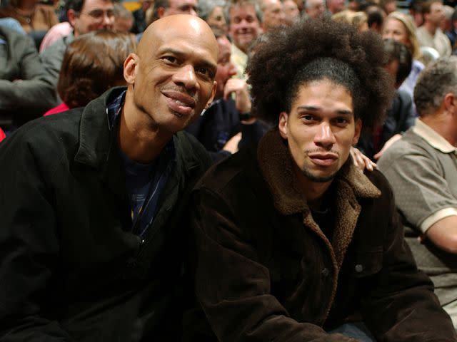 <p>Catherine Steenkeste/NBAE/Getty</p> Kareem Abdul-Jabbar and his son Kareem Abdul-Jabbar Jr. attend the Los Angeles Lakers against the New York Knicks.