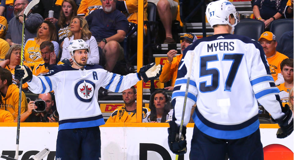 Mark Scheifele celebrates with teammate Tyler Myers after scoring a goal against the Nashville Predators (Photo by Frederick Breedon/Getty Images)