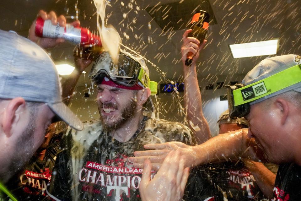 The Texas Rangers celebrate after Game 7 of the baseball AL Championship Series against the Houston Astros Monday, Oct. 23, 2023, in Houston. The Rangers won 11-4 to win the series 4-3. (AP Photo/Godofredo A. Vásquez)