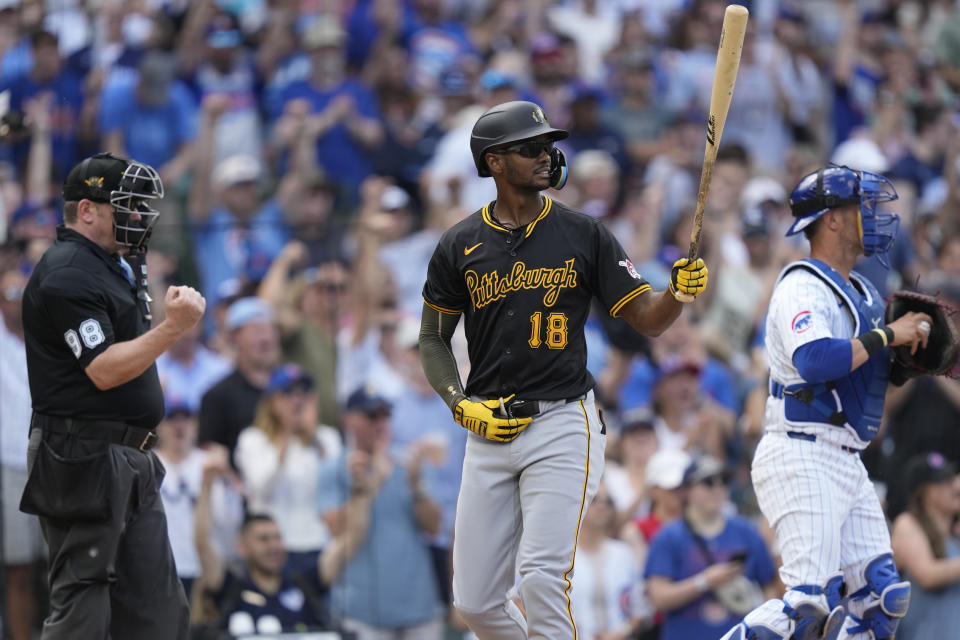 Pittsburgh Pirates' Michael A. Taylor heads to the dugout after striking out to end the top of the seventh inning, stranding two baserunners, in a baseball game against the Chicago Cubs, Saturday, May 18, 2024, in Chicago. (AP Photo/Charles Rex Arbogast)