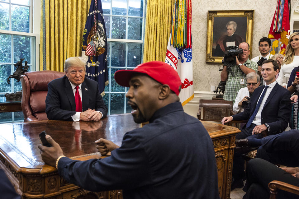 Then-President Donald Trump meets with rapper Kanye West in the Oval Office of the White House on Oct. 11, 2018. (Calla Kessler / The Washington Post via Getty Images file)