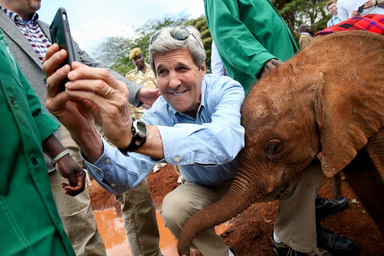 John Kerry takes a selfie with a baby elephant at the Sheldrick Center Elephant Orphanage in the Nairobi National Park on May 3, 2015