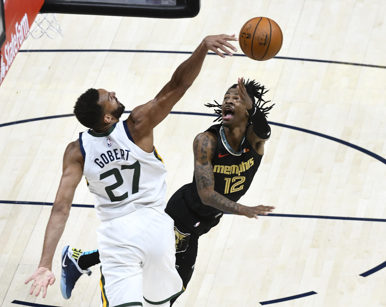 Rudy Gobert blocks a shot by Ja Morant.