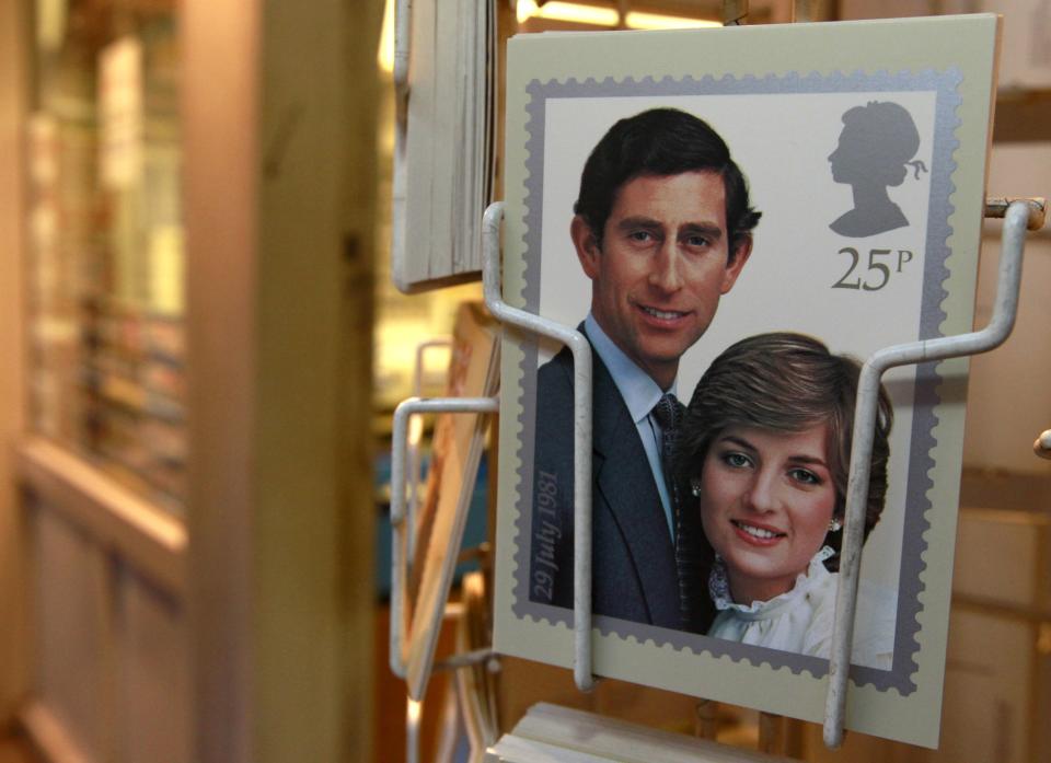 A postcard showing a commemorative stamp celebrating the wedding of Prince Charles and Lady Diana Spencer in 1981, is displayed outside a philatelists in London November 23, 2010. Britain's Prince William is to marry his fiancee Kate Middleton on Friday, April 29 next year at London's Westminster Abbey.    REUTERS/Luke MacGregor    (BRITAIN - Tags: ENTERTAINMENT SOCIETY ROYALS)