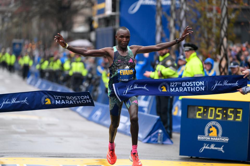 Evans Chebet of Kenya crosses the finish line to win the men's division at the 2023 Boston Marathon on April 17, 2023.