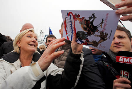 Marine Le Pen, French National Front (FN) political party candidate for French 2017 presidential election, reacts after an excursion on a fishing boat during a campaign visit to the port in Grau-du-Roi, France, April 27, 2017. REUTERS/Jean-Paul Pelissier