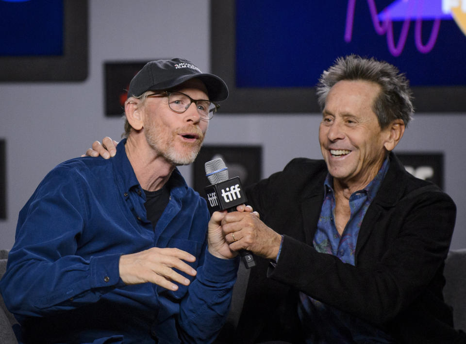 Executive Producers Ron Howard, left, and Brian Grazer attend a press conference to promote the movie "Once Were Brothers: Robbie Robertson and The Band" during the 2019 Toronto International Film Festival in Toronto on Thursday, Sept. 5, 2019. (Andrew Lahodynskyj/The Canadian Press via AP)