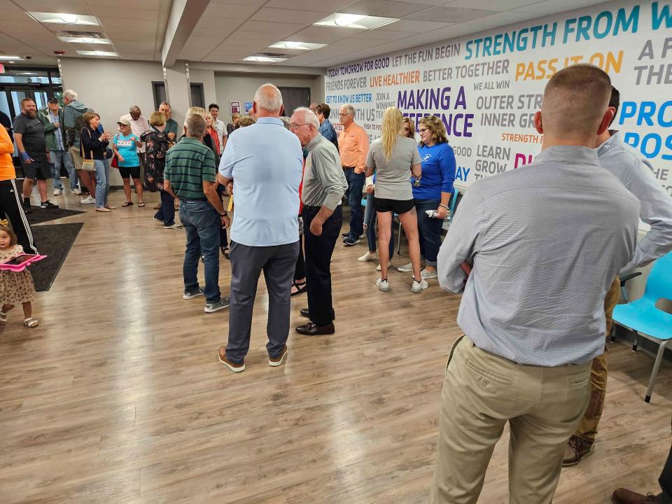 People mingle at the YMCA grand re-opening ceremony Thursday in Ashland.