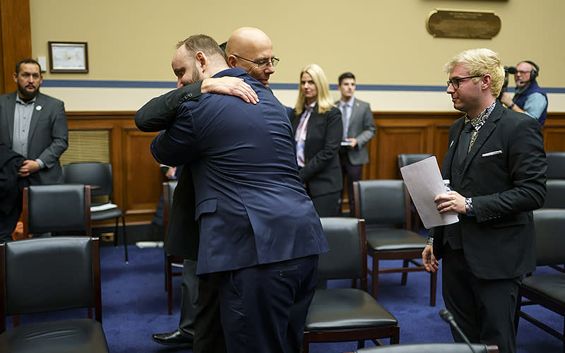 Club Q nightclub owner Matthew Hayes hugs Club Q shooting survivor James Slaugh after giving statements at a House Oversight and Reform Committee hearing titled “The Rise of Anti-LGBTQI+ Extremism and Violence in the United States” on Dec. 14. <em>Greg Nash</em>