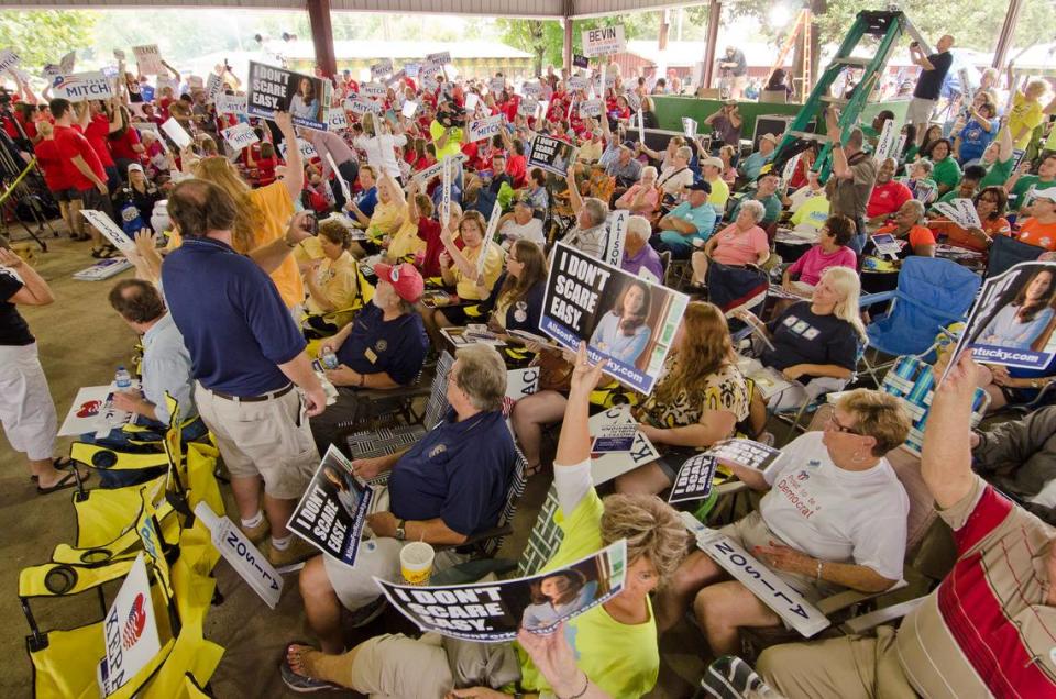 Supporters of U.S. Sen. Mitch McConnell and Kentucky Sec. of State Alison Grimes start a shouting match Saturday at the 133rd Fancy Farm Picnic. Photo by John Flavell