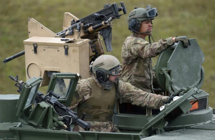 The move will cut the current US troop level in Germany from about 34,500 to 25,000, President Donald Trump's stated goal (US troops pictured near Grafenwoehr, Germany in 2017) (AFP Photo/Christof STACHE)