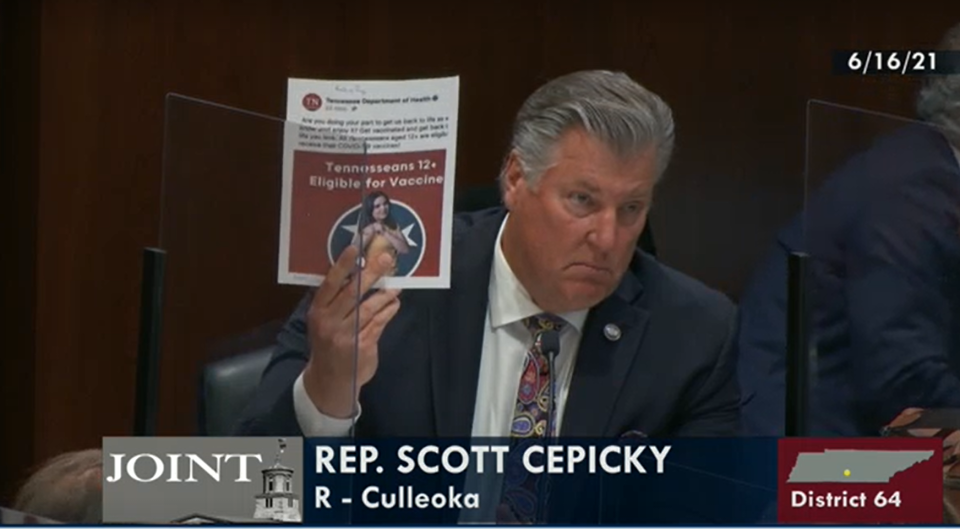 Rep. Scott Cepicky, R-Culleoka, holds up a print out of a Tennessee Department of Health Facebook post promoting vaccinations while questioning the agency on June 16. Cepicky proposed the possibility of dissolving the entire agency to stop it from "peer pressuring" teenagers to get vaccinated against coronavirus.