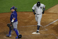 Toronto Blue Jays catcher Alejandro Kirk turns away as New York Yankees' Gary Sanchez steps on home plate after hitting a three-run home run during the fourth inning of a baseball game on Tuesday, Sept. 15, 2020, in New York. (AP Photo/Adam Hunger)