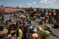 <p>Thousands of Rohingya refugees fleeing from Myanmar are kept under a tight security by Bangladeshi military in hot sun near Palang Khali, Cox’s Bazar, Bangladesh, on October 16, 2017. (Photograph by Paula Bronstein/Getty Images) </p>