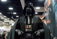 <p>It wouldn’t be Comic-Con without a menacing appearance from Lord Vader, who’s also about <a href="https://www.yahoo.com/movies/lucasfilm-head-darth-vader-has-very-very-131112487.html" data-ylk="slk:to return to big screens in the;elm:context_link;itc:0;sec:content-canvas;outcm:mb_qualified_link;_E:mb_qualified_link;ct:story;" class="link  yahoo-link">to return to big screens in the </a><i><a href="https://www.yahoo.com/movies/lucasfilm-head-darth-vader-has-very-very-131112487.html" data-ylk="slk:Star Wars;elm:context_link;itc:0;sec:content-canvas;outcm:mb_qualified_link;_E:mb_qualified_link;ct:story;" class="link  yahoo-link">Star Wars</a> </i>spinoff movie <i>Rogue One</i>. <i>(Photo: Matt Cowan/Getty Images)</i><br></p>