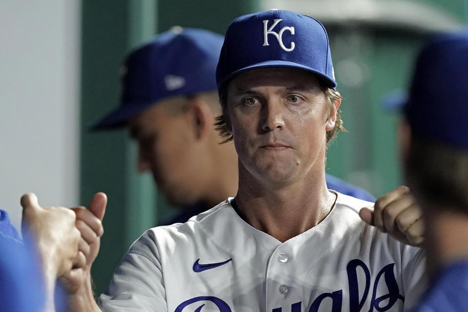 Kansas City Royals starting pitcher Zack Greinke greets teammates ion the dugout after coming out of the baseball game during the sixth inning against the Minnesota Twins Tuesday, Sept. 20, 2022, in Kansas City, Mo. (AP Photo/Charlie Riedel)