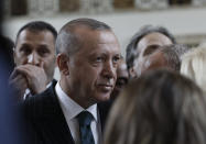 Turkey's President Recep Tayyip Erdogan speaks to the media after his address to his ruling party MPs, in Ankara, Turkey, Tuesday, June 25, 2019, two days after Ekrem Imamoglu, the candidate of the secular opposition Republican People's Party, won the election for mayor of Istanbul. Erdogan addressed his AK Party's weekly meeting, the first time he speaks since the Istanbul mayoral election Sunday, which was a big setback for him and his party. (AP Photo/Burhan Ozbilici)