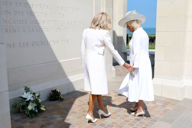 <p>CHRIS JACKSON/POOL/AFP via Getty</p> Brigitte Macron and Queen Camilla at the Ministry of Defense and Royal British Legion's event commemorating the 80th anniversary of the D-Day Landings at the British Normandy Memorial on June 06, 2024, in Ver-Sur-Mer, France.