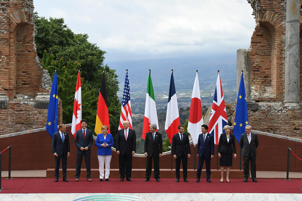  President of the European Council Donald Tusk, Candian Prime Minister Justin Trudeau, German Chancellor Angela Merkel, US President Donald Trump, Italian Prime Minister Paolo Gentiloni, French President Emmanuel Macron, Japanese Prime Minister Shinzo Abe, Prime Minister Theresa May and President of the European Commission Jean-Claude Juncker pose for the family photo at the G7 summit in 2017. (PA)