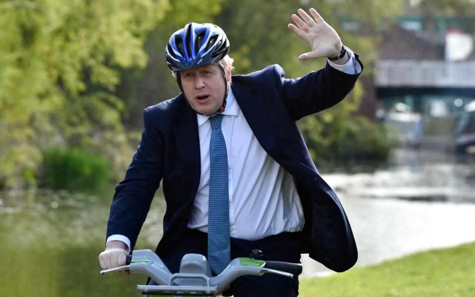 Boris Johnson on the campaign trail ahead of tomorrow's local elections - Rui Vieira/AFP